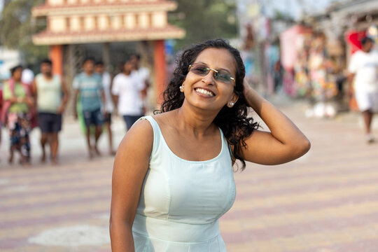 Indian woman enjoying beach time  
