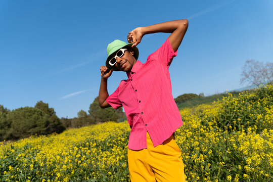 Happy man dancing field spring