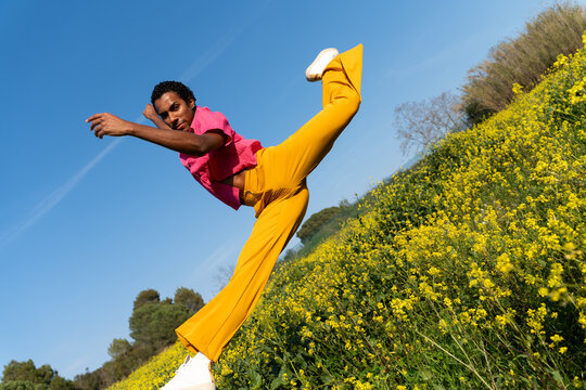 Happy man dancing field spring