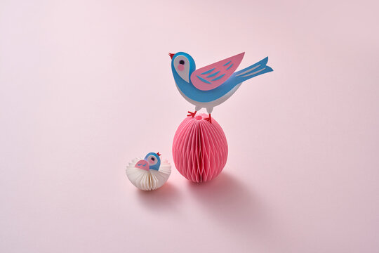 Paper spring craft bird on easter egg