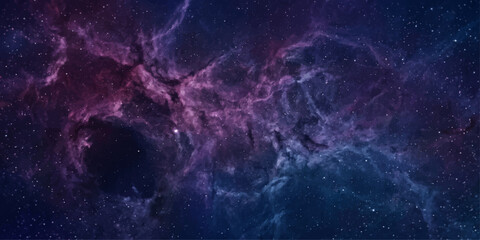 A breathtaking cosmic nebula glows with ethereal beauty, displaying a vibrant spectrum of purple and blue hues against a backdrop of distant stars. © suriyaakter