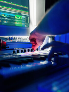 Man making electronic music in home studio 
