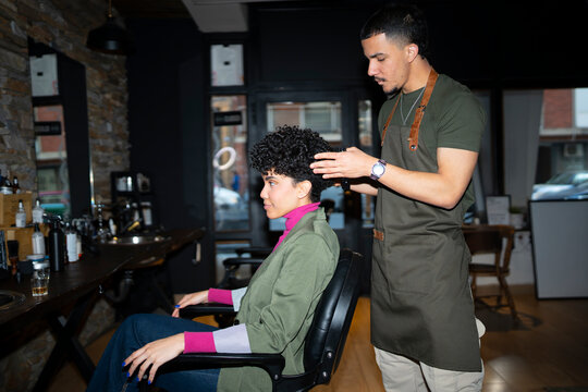 Stylist working with client in a hair salon