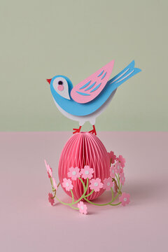 Paper spring craft bird on floral easter egg
