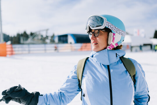 Woman in Ski Gear on Snowy Mountain
