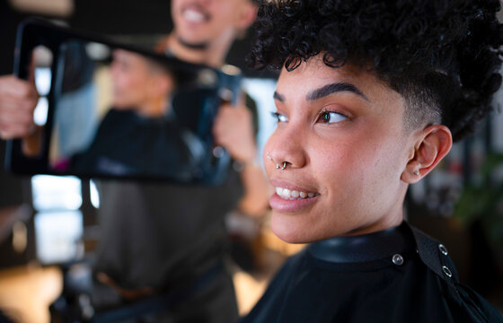 Woman at salon getting hair styled