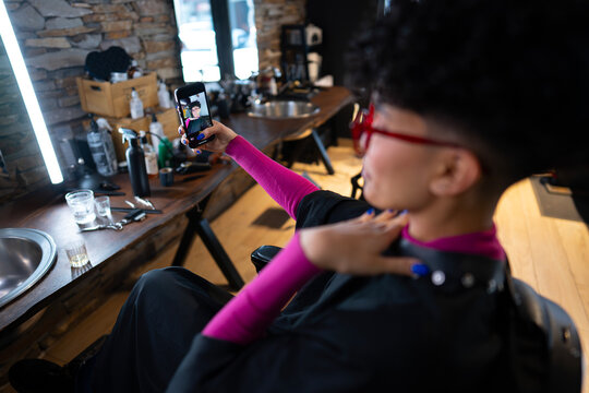 Taking a selfie in a barbershop chair