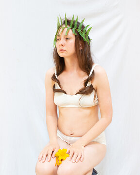 Calm portrait of a woman with fern crown 4