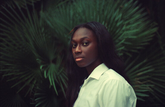Portrait Against Palm Leaves
