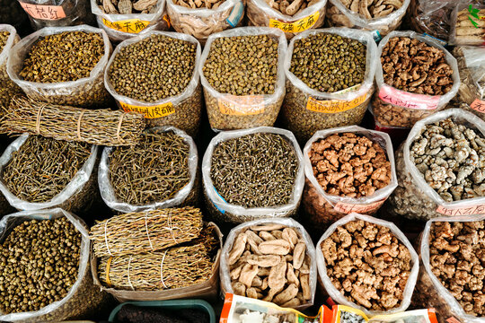 Colorful Spices and Herbs Display at a Vibrant Market Stall