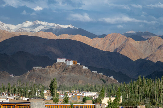 Buddhist monastery on hilltop with Himalayan mountains in Ladakh