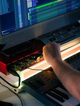 Music Producer Working in a Studio With Audio Equipment