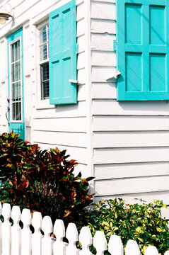 Historic home with colorful turquoise shutters in Hope Town, Bahamas
