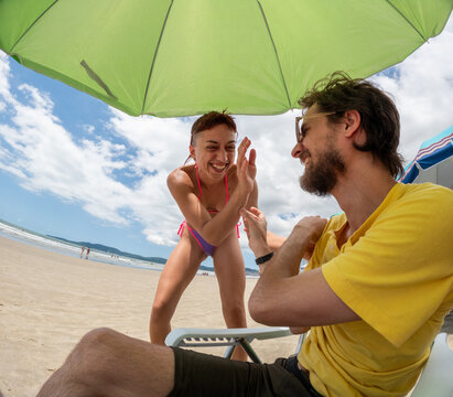 Fun Moments on the Beach With Friends During a Sunny Day