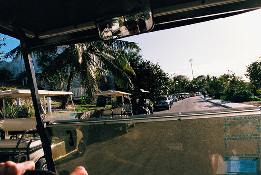 View from golf cart of streets of Hope Town Settlement, Bahamas