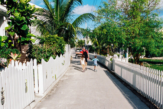 Family explores Hope Town settlement on Elbow Cay, Bahamas