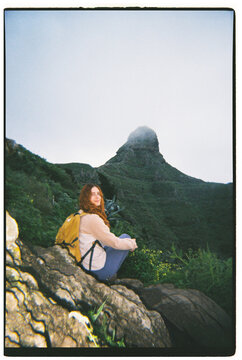 Hiker Resting on Rocks With Mountain Peak in Tenerife