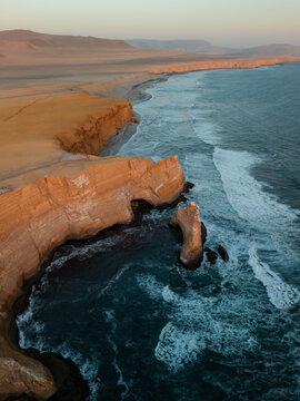 Aerial view of Pacific ocean at Paracas Nature Reserve at sunset 