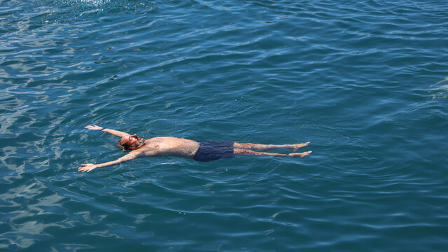 Man Relaxing in the Ocean