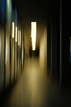 Long exposure motion blur in a concrete urban passage at night