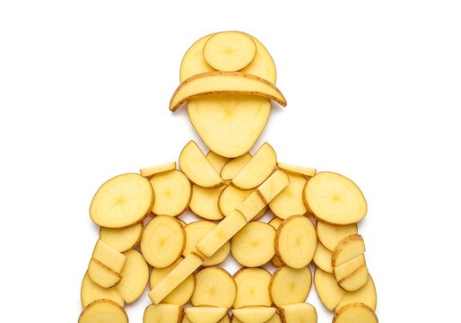 Creative figure made from sliced potato pieces arranged as a human soldier with a hat and sword