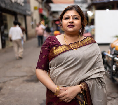 Indian woman wearing traditional sari dress in a metropolitan city 