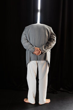 A man in a dark room.
