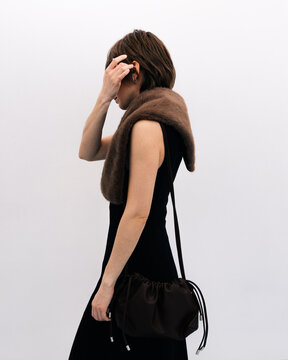 Side View Short Hair Black Dress Brown Leather Bag on Shoulder