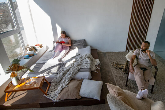 Interracial couple relaxing at home