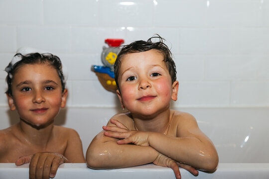 Young boys enjoying fun bath time together