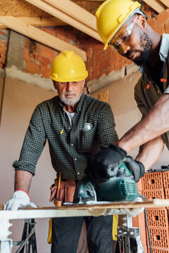 Construction Workers using Circular Saw 
