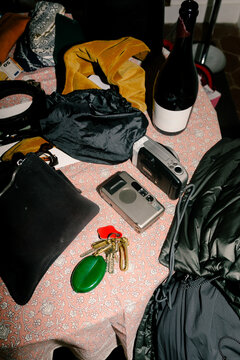 Close-up, lit by direct flash, of a desk surface with personal items