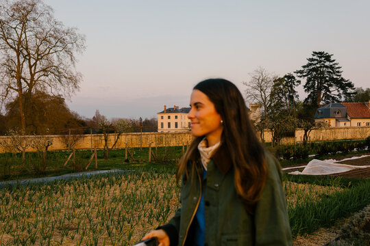Focused background of a rural hotel in Paris with blurred woman