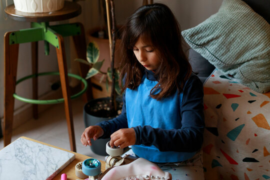 Child adjusting roller skate