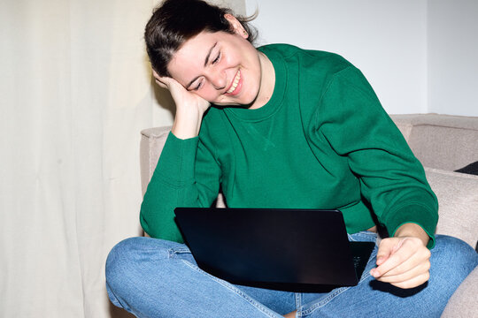 Woman smiling enjoying streaming media