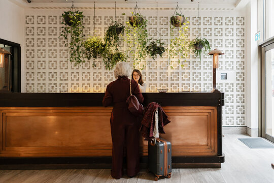 Traveler arriving at hotel reception for check-in