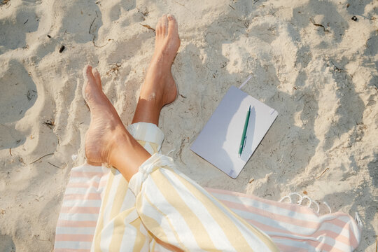 POV Relaxing on Summer Beach with Notebook