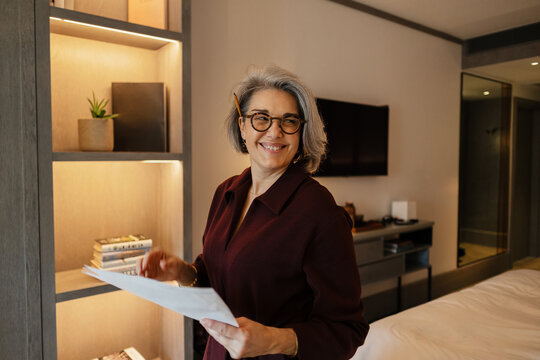 Professional working with documents in stylish home office