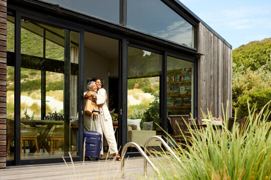 Couple embraces while enjoying their vacation rental house