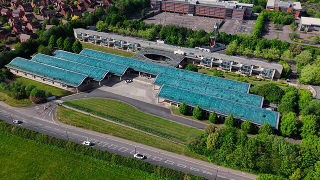 Aerial view of Bp Pulse Charging Station with modern architecture and green surroundings Coventry, England, United Kingdom.
