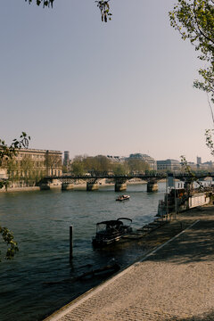 Urban landscape featuring the Seine River during sunset