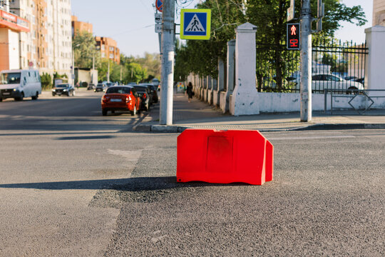 Traffic Barrier on a City Street During Daylight in Urban Area
