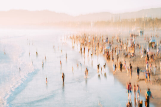 Blurred Crowd Walking Along Santa Monica Beach Shoreline
