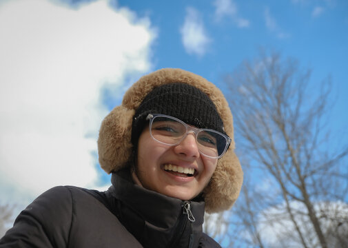 A girl laughing on a sunny day
