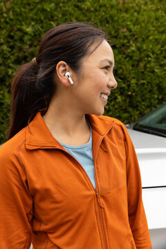 Pretty Asian fitness model Portrait with earbuds