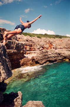 110 Film UGC Man Jumping in the Sea Enjoying Freedom