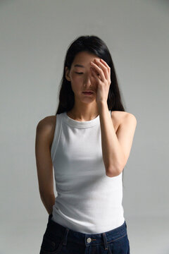 Person experiencing headache or emotional pain