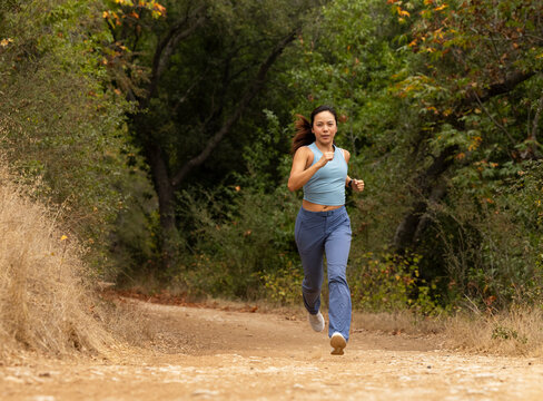 Asian fitness woman athlete  running trail