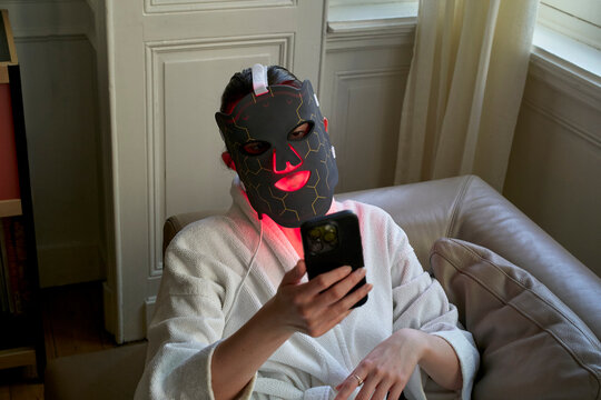 Using a Mask for Skin Treatment While Sitting on a Couch