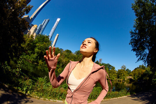Woman jogs in Central Park.